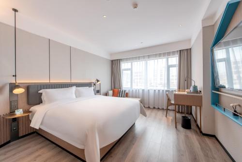 Imagen de la habitación del Hotel 宜尚酒店湛江遂溪全丰广场店. Foto 18