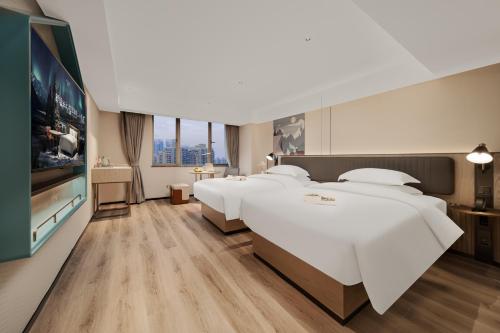 Imagen de la habitación del Hotel 宜尚酒店广州白云站聚龙地铁站店. Foto 18