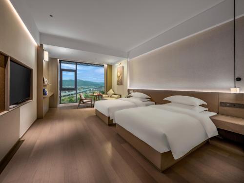 Imagen de la habitación del Hotel 诸暨云满屋艺术酒店. Foto 15