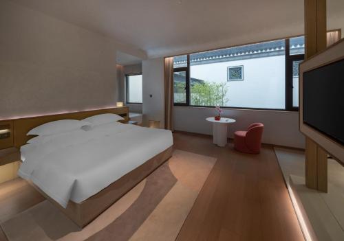 Imagen de la habitación del Hotel 诸暨云满屋艺术酒店. Foto 16