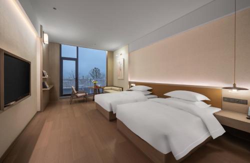 Imagen de la habitación del Hotel 诸暨云满屋艺术酒店. Foto 18