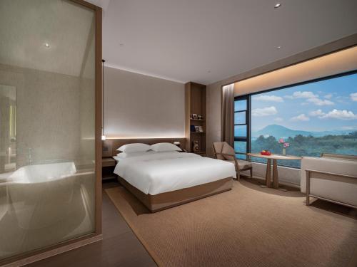 Imagen de la habitación del Hotel 诸暨云满屋艺术酒店. Foto 19