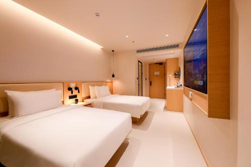 Imagen de la habitación del Hotel 深圳芈白酒店. Foto 16