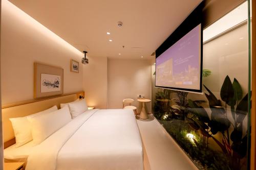Imagen de la habitación del Hotel 深圳芈白酒店. Foto 18