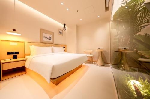 Imagen de la habitación del Hotel 深圳芈白酒店. Foto 20