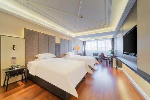 Imagen de la habitación del Hotel 锦江都城海门狮山宾馆酒店. Foto 17