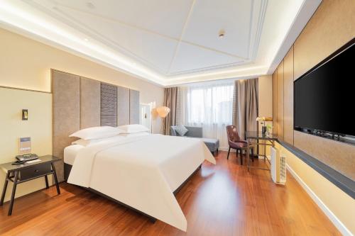 Imagen de la habitación del Hotel 锦江都城海门狮山宾馆酒店. Foto 18