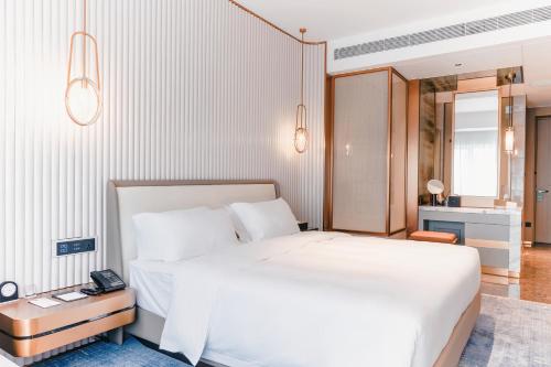 Imagen de la habitación del Hotel 湛江白天鹅酒店. Foto 11