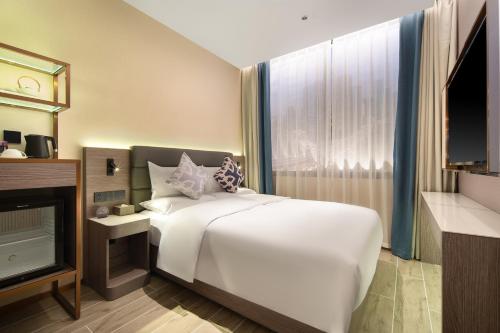 Imagen de la habitación del Hotel 朗丽兹酒店深圳罗湖口岸店. Foto 13