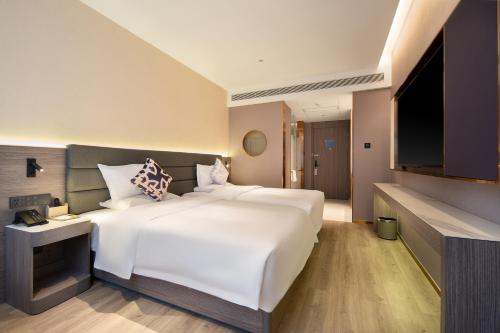 Imagen de la habitación del Hotel 朗丽兹酒店深圳罗湖口岸店. Foto 16