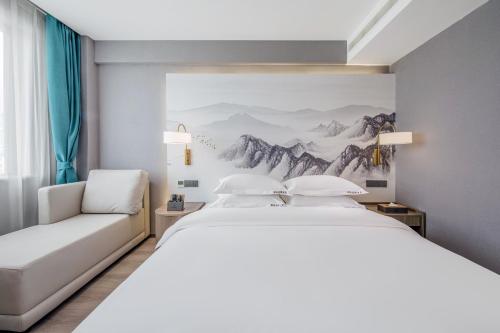 Imagen de la habitación del Hotel 丽江古城丽漫酒店. Foto 16