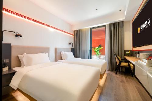 Imagen de la habitación del Hotel 厦门中山路步行街趣栗酒店. Foto 17