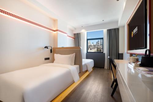 Imagen de la habitación del Hotel 厦门中山路步行街趣栗酒店. Foto 19