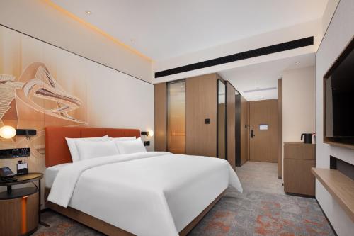 Imagen de la habitación del Hotel 广州新塘高铁站希尔顿欢朋酒店. Foto 15