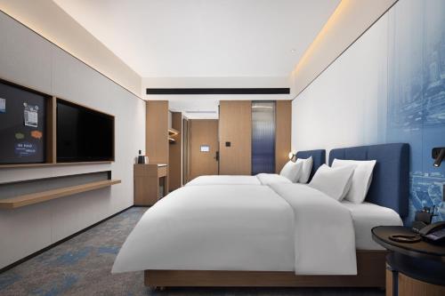 Imagen de la habitación del Hotel 广州新塘高铁站希尔顿欢朋酒店. Foto 16