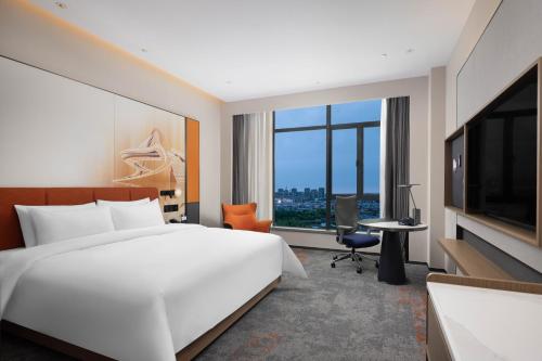 Imagen de la habitación del Hotel 广州新塘高铁站希尔顿欢朋酒店. Foto 18