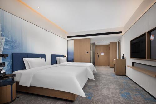 Imagen de la habitación del Hotel 广州新塘高铁站希尔顿欢朋酒店. Foto 19