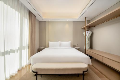 Imagen de la habitación del Hotel 苏州山塘街华贸姑苏里服务公寓. Foto 18