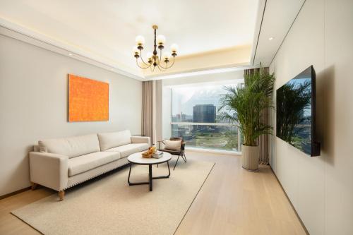 Imagen de la habitación del Hotel 苏州山塘街华贸姑苏里服务公寓. Foto 19