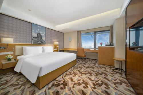 Imagen de la habitación del Hotel 佛山南海金融城瑾程酒店. Foto 15