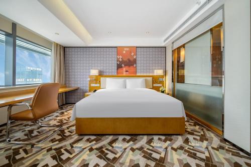Imagen de la habitación del Hotel 佛山南海金融城瑾程酒店. Foto 17
