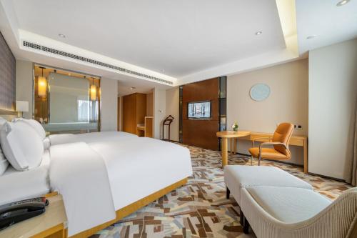 Imagen de la habitación del Hotel 佛山南海金融城瑾程酒店. Foto 19