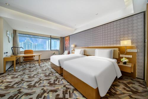 Imagen de la habitación del Hotel 佛山南海金融城瑾程酒店. Foto 20