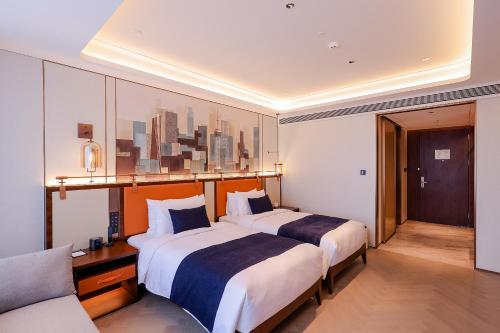 Imagen de la habitación del Hotel 上海虹桥兖矿郁锦香酒店. Foto 18