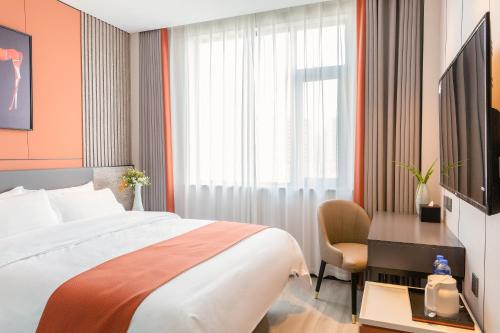 Imagen de la habitación del Hotel 昊丽贵阳喷水池地铁站酒店. Foto 16