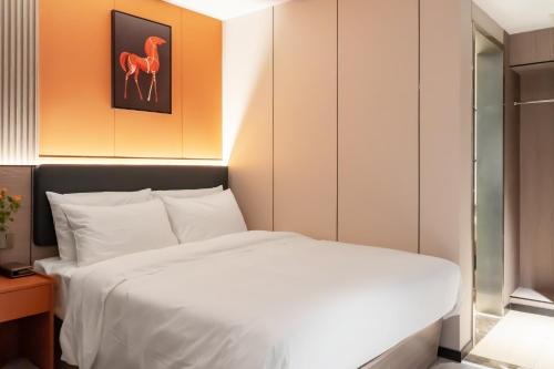 Imagen de la habitación del Hotel 昊丽贵阳喷水池地铁站酒店. Foto 18
