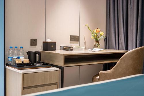 Imagen de la habitación del Hotel 昊丽贵阳喷水池地铁站酒店. Foto 19
