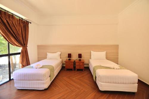 Imagen de la habitación del Hotel 沙巴海豚岛酒店. Foto 15