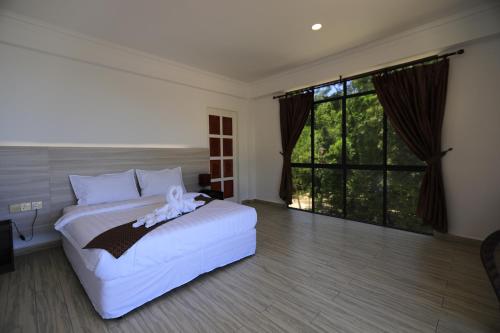 Imagen de la habitación del Hotel 沙巴海豚岛酒店. Foto 16