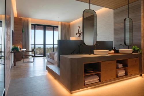 Imagen de la habitación del Hotel 1 Haitang Bay Sanya. Foto 3