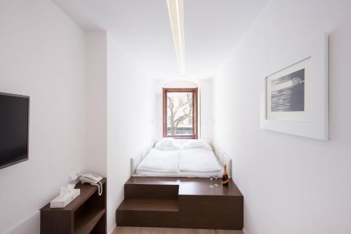 Imagen de la habitación del Hotel 100. Foto 6