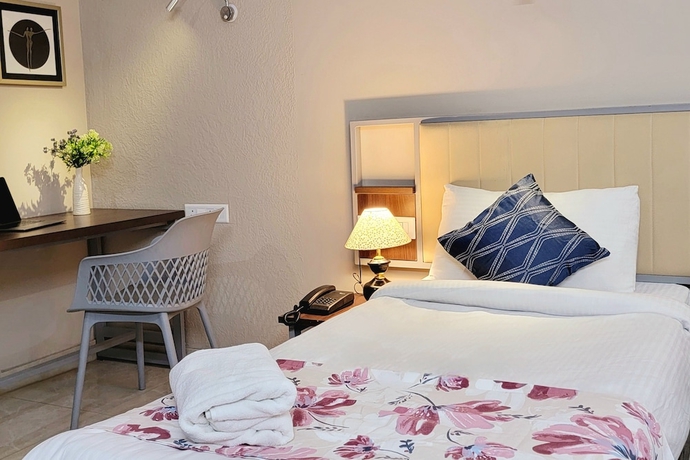 Imagen de la habitación del Hotel 1047 Vamsor heights. Foto 9