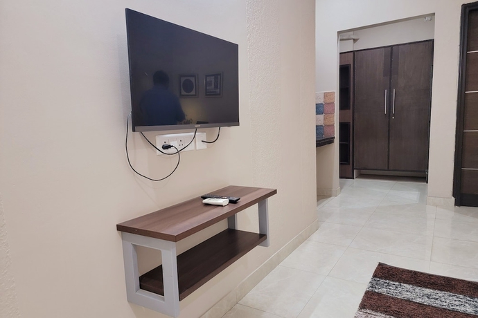 Imagen de la habitación del Hotel 1047 Vamsor heights. Foto 15