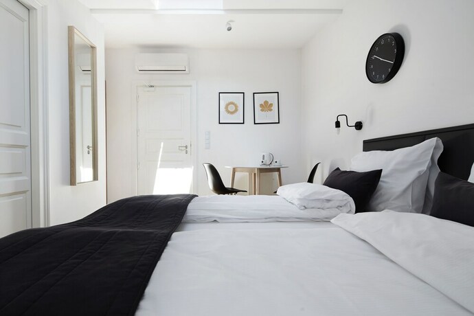 Imagen de la habitación del Hotel 1891 Aparthotel Attic. Foto 7