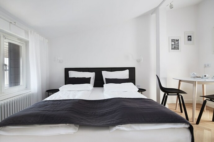 Imagen de la habitación del Hotel 1891 Aparthotel Attic. Foto 11