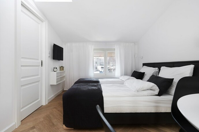 Imagen de la habitación del Hotel 1891 Aparthotel Attic. Foto 15