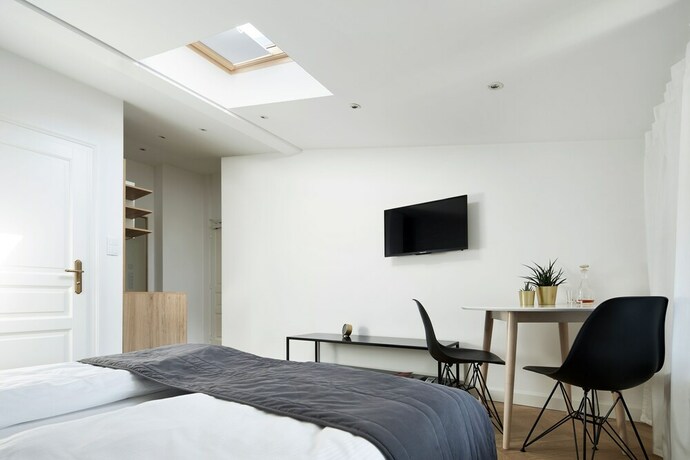 Imagen de la habitación del Hotel 1891 Aparthotel Attic. Foto 18