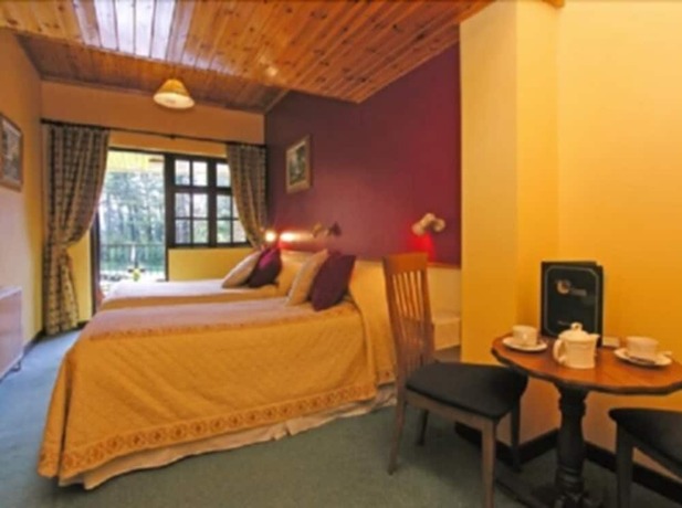 Imagen de la habitación del Hotel 19th Green guesthouse. Foto 15