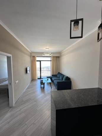 Imagen de la habitación del Hotel 1BR with Balcony Pool and Sauna. Foto 1