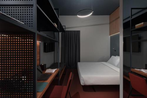 Imagen de la habitación del Hotel 21 House Of Stories Navigli. Foto 11