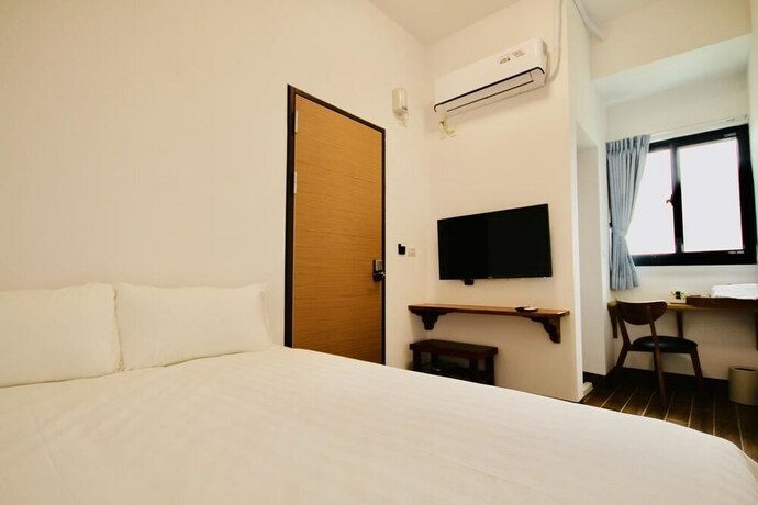 Imagen de la habitación del Hotel 25 Inn Kenting Henchun. Foto 20