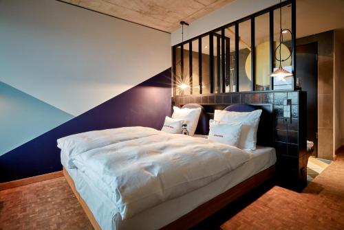 Imagen de la habitación del Hotel 25hours Das Tour. Foto 20