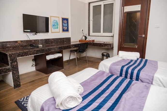 Imagen de la habitación del Hotel 26 Vamsor Heights. Foto 2