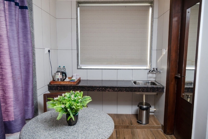 Imagen de la habitación del Hotel 26 Vamsor Heights. Foto 12