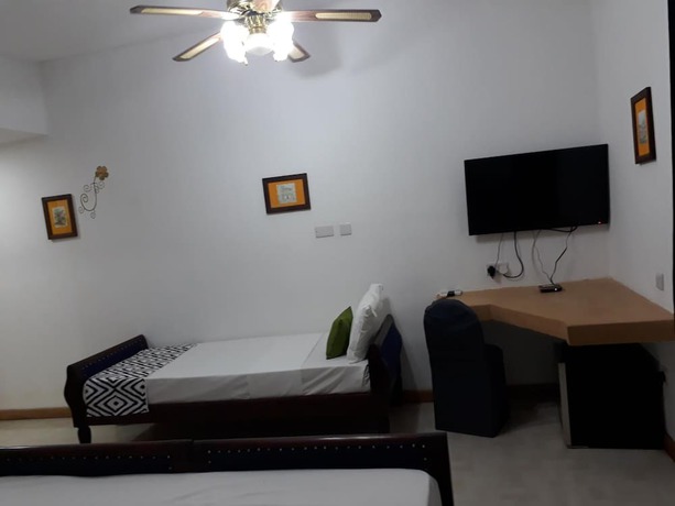 Imagen de la habitación del Hotel 27 Cafe Zanzibar Airport. Foto 9