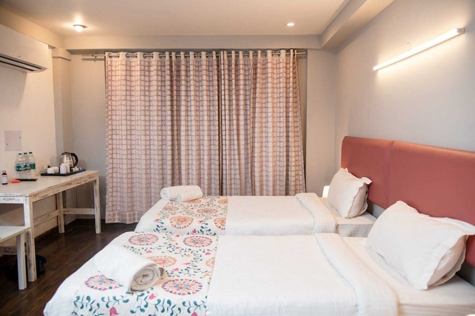 Imagen de la habitación del Hotel 30 Vamsor Heights. Foto 9